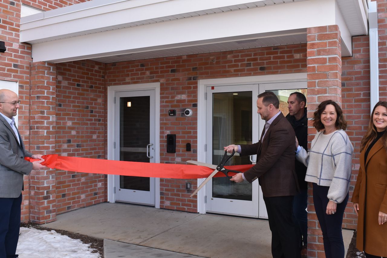First of 2 apartments buildings opens at large mixed-use development